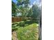Private fenced backyard with mature trees and plenty of space for recreation at 6434 Tidewave St, Orlando, FL 32822