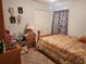 Bedroom featuring carpet floors, curtains and closet doors at 6434 Tidewave St, Orlando, FL 32822