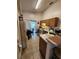 Functional kitchen with laminate countertops, tiled floors and a breakfast nook at 6434 Tidewave St, Orlando, FL 32822