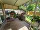 Enclosed sunroom featuring tiled floors, plants and natural light at 6434 Tidewave St, Orlando, FL 32822