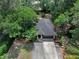 An aerial view of a home with well-maintained landscaping and a private driveway at 670 N Sparkman Ave, Orange City, FL 32763