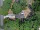 Overhead view of a house surrounded by mature trees showcasing privacy and seclusion at 670 N Sparkman Ave, Orange City, FL 32763