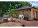Backyard featuring outdoor kitchen and dining area on the deck with natural views at 670 N Sparkman Ave, Orange City, FL 32763