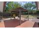 Cozy backyard featuring a brick and painted patio with a covered gazebo with seating at 670 N Sparkman Ave, Orange City, FL 32763