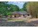 Aerial backyard view of covered gazebo, brick patio, outdoor dining, and a full outdoor kitchen at 670 N Sparkman Ave, Orange City, FL 32763