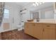 Bathroom featuring a vanity, tile flooring, and accessibility features at 670 N Sparkman Ave, Orange City, FL 32763