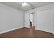 Bedroom featuring a ceiling fan, closet and tile flooring at 670 N Sparkman Ave, Orange City, FL 32763