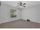 Bedroom featuring a ceiling fan, neutral paint and carpet flooring at 670 N Sparkman Ave, Orange City, FL 32763
