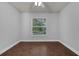 Bedroom featuring a window and tile flooring at 670 N Sparkman Ave, Orange City, FL 32763
