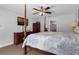 Bedroom featuring a four-poster bed, ceiling fan, and mounted television at 670 N Sparkman Ave, Orange City, FL 32763