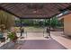 Covered gazebo with ceiling fan and bistro lighting on a brick and painted patio at 670 N Sparkman Ave, Orange City, FL 32763
