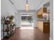 Bright kitchen with tile floors, modern cabinets, and a sliding door to the outdoor patio at 670 N Sparkman Ave, Orange City, FL 32763