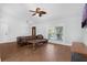 Cozy living room featuring tile floors, modern furniture, and plenty of natural light at 670 N Sparkman Ave, Orange City, FL 32763