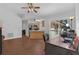 Open-concept living room connected to kitchen with vaulted ceilings and lots of light at 670 N Sparkman Ave, Orange City, FL 32763
