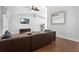 Open-concept living room with tile floors, vaulted ceiling, and modern furnishings at 670 N Sparkman Ave, Orange City, FL 32763