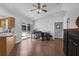Bright office space with vaulted ceiling, fan, and adjacent kitchen at 670 N Sparkman Ave, Orange City, FL 32763