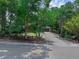 Charming single-story home nestled among lush trees, with a long driveway at 670 N Sparkman Ave, Orange City, FL 32763
