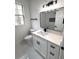 Modern bathroom featuring new fixtures, sink, mirror and tiling at 7147 Yacht Basin Ave # 119, Orlando, FL 32835