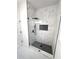Stylish bathroom featuring glass shower with modern fixtures, and updated tiling at 7147 Yacht Basin Ave # 119, Orlando, FL 32835