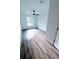 Cozy bedroom with wood-look floors and natural light at 7147 Yacht Basin Ave # 119, Orlando, FL 32835