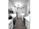 Well-lit kitchen featuring modern white cabinets, stainless steel appliances and hard surface countertops at 7147 Yacht Basin Ave # 119, Orlando, FL 32835