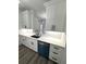 Bright kitchen featuring white cabinets, a stainless steel sink and stainless steel dishwasher at 7147 Yacht Basin Ave # 119, Orlando, FL 32835