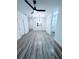Spacious living area showcasing open floor plan and wood-look flooring at 7147 Yacht Basin Ave # 119, Orlando, FL 32835