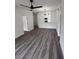 Open living room showcasing the updated kitchen with modern light fixture and stainless sink at 7147 Yacht Basin Ave # 119, Orlando, FL 32835
