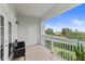 Private balcony offering tranquil views of the lush green landscape and the clear blue sky above at 7630 Heritage Crossing Way # 302, Reunion, FL 34747