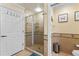 Modern bathroom featuring a glass-enclosed shower, tiled walls, and contemporary fixtures for a spa-like experience at 7630 Heritage Crossing Way # 302, Reunion, FL 34747