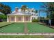 Outdoor bocce ball court in a meticulously landscaped garden setting, promoting outdoor recreation and social activities at 7630 Heritage Crossing Way # 302, Reunion, FL 34747