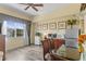 Bright dining area with a large window and stainless steel appliances at 7630 Heritage Crossing Way # 302, Reunion, FL 34747