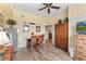 Bright dining area features wood-look floors, an armoire, and stainless steel refrigerator at 7630 Heritage Crossing Way # 302, Reunion, FL 34747