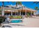 Relaxing hot tub with a lounge area and an outdoor covered patio at 7630 Heritage Crossing Way # 302, Reunion, FL 34747