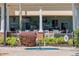 Relaxing poolside bar with lounge area and outdoor dining, perfect for enjoying refreshments by the water at 7630 Heritage Crossing Way # 302, Reunion, FL 34747