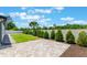 The landscaped backyard has a brick patio, offering an ideal setting for relaxation at 7664 Clubhouse Estates Dr, Orlando, FL 32819