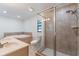 Well-lit bathroom features a glass shower, a soaking tub, and dual sinks at 7664 Clubhouse Estates Dr, Orlando, FL 32819