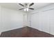 Bedroom featuring hardwood floors, closet, ceiling fan and neutral colored walls at 7664 Clubhouse Estates Dr, Orlando, FL 32819