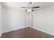 Bedroom featuring hardwood floors, ceiling fan, a closet, and neutral walls at 7664 Clubhouse Estates Dr, Orlando, FL 32819