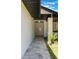 The walkway to the front entry provides a seamless welcome, flanked by lush plantings at 7664 Clubhouse Estates Dr, Orlando, FL 32819