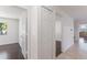 Hallway between rooms with access to bedrooms, closets, and other living areas at 7664 Clubhouse Estates Dr, Orlando, FL 32819