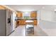 Kitchen with stainless steel appliances, granite countertops, and a central kitchen island at 7664 Clubhouse Estates Dr, Orlando, FL 32819