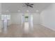 Large open living room with tile floors, recessed lighting, and windows providing natural light and an airy feel at 7664 Clubhouse Estates Dr, Orlando, FL 32819