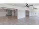 Spacious living room with tile floors and a view of the front door at 7664 Clubhouse Estates Dr, Orlando, FL 32819