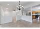 Open-concept space with tile floors, recessed lights, and a clear view of the modern kitchen with stainless appliances at 7664 Clubhouse Estates Dr, Orlando, FL 32819