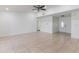 Spacious living area with tile floors, ample natural light, and a large open floor plan for flexible living at 7664 Clubhouse Estates Dr, Orlando, FL 32819