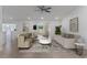 Bright living room features recessed lighting, ceiling fan, tile floors, and neutral paint colors at 7664 Clubhouse Estates Dr, Orlando, FL 32819