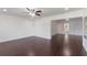 Hardwood floor living room with plenty of space and natural light at 7664 Clubhouse Estates Dr, Orlando, FL 32819