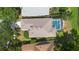 Aerial view of a single-Gathering home with a screened-in pool and well-maintained landscaping at 829 Lakeworth Cir, Lake Mary, FL 32746