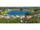 Aerial view showcasing a lakefront community with mature trees and well-maintained landscaping at 829 Lakeworth Cir, Lake Mary, FL 32746